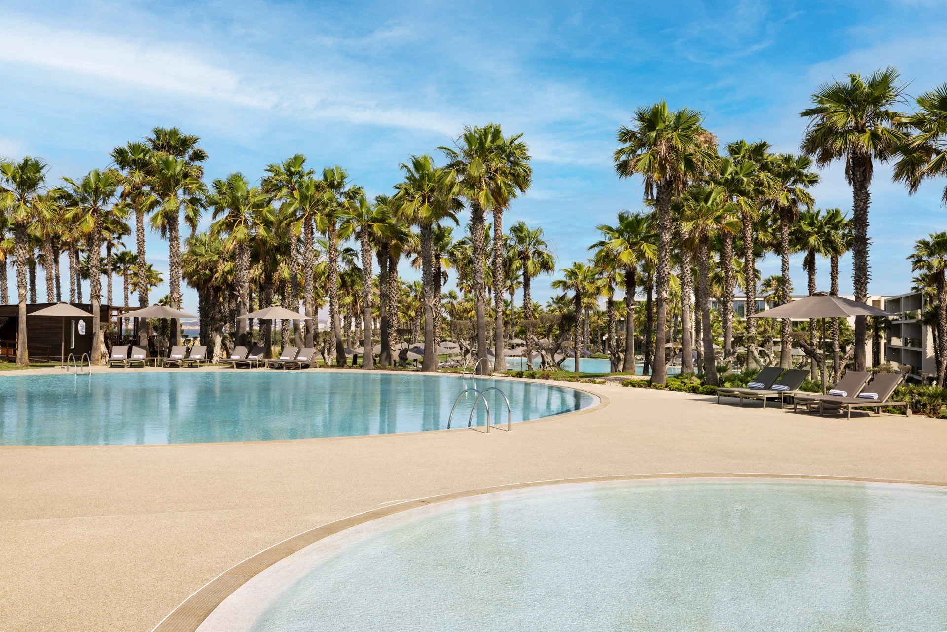 The Westin Salgados Beach Resort, Algarve · View of the outdoor swimming pools surrounded by p